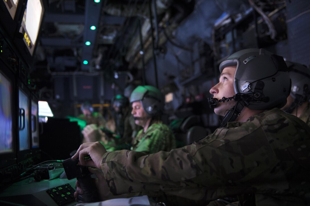 An airman conducts a systems setup aboard an AC-130W Stinger II aircraft during Emerald Warrior 16 at Hurlburt Field, Fla., May 3, 2016. The airman is a navigator assigned to the 16th Special Operations Squadron. Air Force photo by Staff Sgt. Matthew B. Frederick