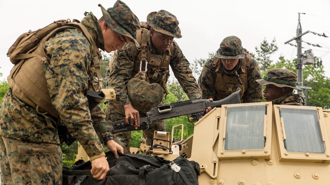 Marines with Marine Wing Support Squadron 171 assemble an M240 Bravo Light-Machine Gun on a high mobility multipurpose wheeled vehicle during exercise Thunder Horse 16.2 at the Japan Ground Self-Defense Force’s Haramura Maneuver Area in Hiroshima, Japan, May 9, 2016. The squadron plans to conduct various drills pertaining to aviation ground support forces, aircraft salvage and recovery, convoys, direct refueling, recovery and general engineering operations, establishing a tactical motor pool, providing air operations and planning expeditionary fire rescue services. The exercise focuses on reinforcing skills that Marines learned during Marine Combat Training and throughout their military occupational specialty schooling in order to maintain situational readiness. 