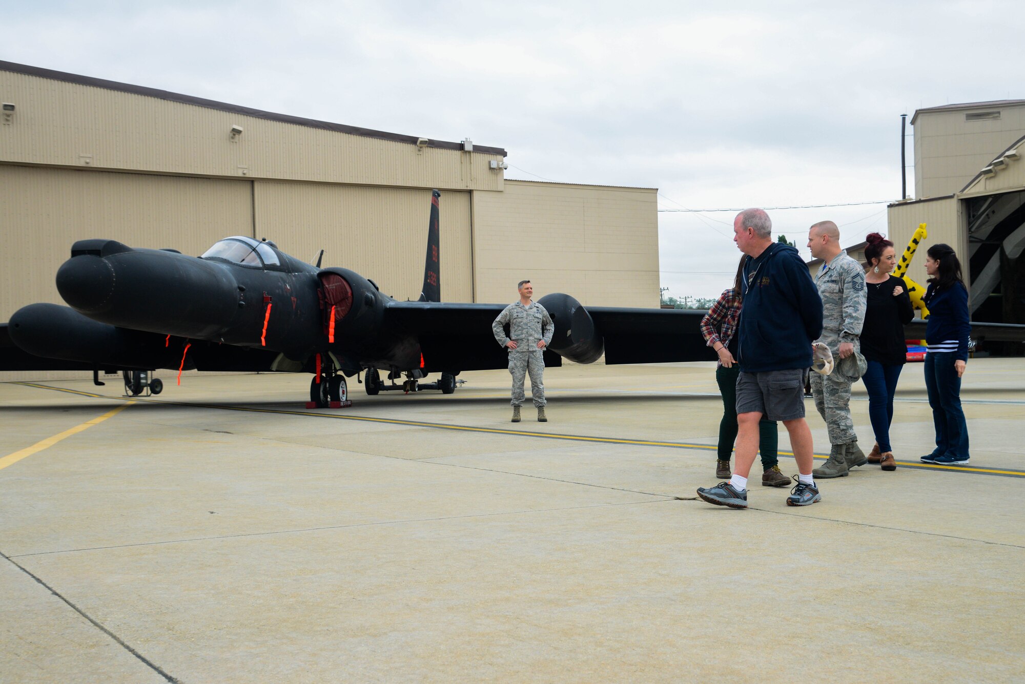 Team Osan families and Airmen gaze upon a U-2 Dragon Lady static display during the 40th Anniversary U-2 Ceremony May 6, 2016, at Osan Air Base, Republic of Korea. Members from the 5th Reconnaissance Squadron organized the ceremony to honor their unit heritage as well as give thanks to Team Osan for their support.  (U.S. Air Force photo by Senior Airman Dillian Bamman/Released)