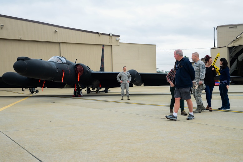 Team Osan families and Airmen gaze upon a U-2 Dragon Lady static display during the 40th Anniversary U-2 Ceremony May 6, 2016, at Osan Air Base, Republic of Korea. Members from the 5th Reconnaissance Squadron organized the ceremony to honor their unit heritage as well as give thanks to Team Osan for their support.  (U.S. Air Force photo by Senior Airman Dillian Bamman/Released)