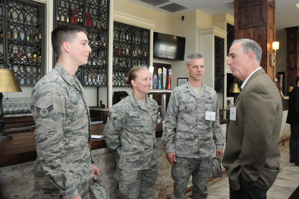 Cliff Holtz (right), American Red Cross president of humanitarian services, speaks with Col. Stephen Slade, 50th Space Wing Individual Mobilization Augmentee to the commander, and Airmen 1st Class Krystal Conkling and Kyle Hacket, 50 SW, during an American Red Cross luncheon in Colorado Springs, Colorado, Thursday, May 5, 2016. Holtz oversees the American Red Cross Service to the Armed Forces programs in addition to the organization’s disaster preparedness, response and recovery programs. (U.S. Air Force photo/2nd Lt. Darren Domingo) 