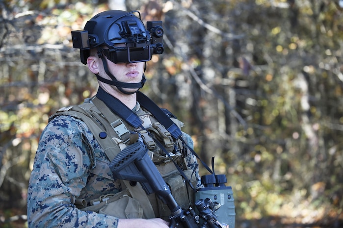 A student in the Marine Corps Infantry Officer Course uses the Augmented Immersive Team Trainer during testing held at Quantico, Va., Nov. 5, 2015. The AITT allows Marines to transform any location into a dynamic training ground by injecting virtual images, indirect fire effects, aircraft, vehicles, simulated people, etc. onto a real-world view of one's surroundings. AITT will be part of the Marine Corps Systems Command display at Sea Air Space May 16-18.  (U.S. Navy photo by John F. Williams)