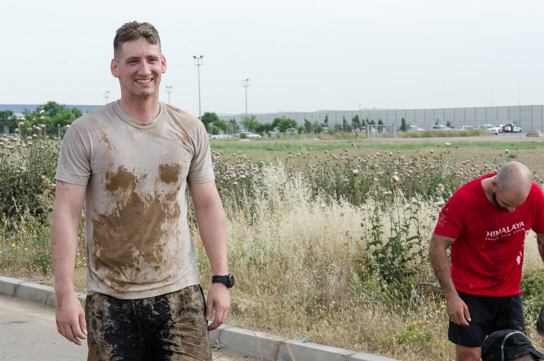 Capt. Marc Eskew, commander of the Operations Company, Headquarters and Headquarters Battalion, 101st Airborne Division (Air Assault), finishes the Kurdish Training Coordination Center Survival Fun Run near Erbil, Iraq, May 6, 2016. The Morale, Welfare and Recreation event consisted of the choice between a 5-, 10- or 15-kilometer route with obstacles spread throughout and allowed Soldiers to have fun and build camaraderie with their peers. (U.S. Army Photo by Staff Sgt. Peter J. Berardi)