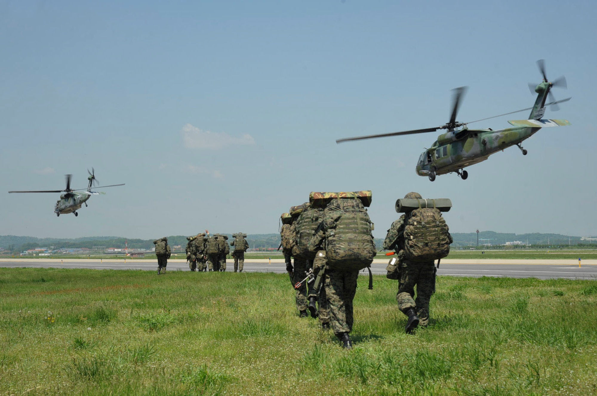 Republic of Korea army special operations forces members ruck march after stepping off of HH-60P Pave Hawks for Exercise Beverly Herd 16-01 May 11, 2016, at Osan Air Base, Republic of Korea. The SOF members trained with the 51st Security Forces Squadron on opposing forces scenarios. (U.S. Air Force photo by Staff Sgt. Jonathan Steffen/Released)