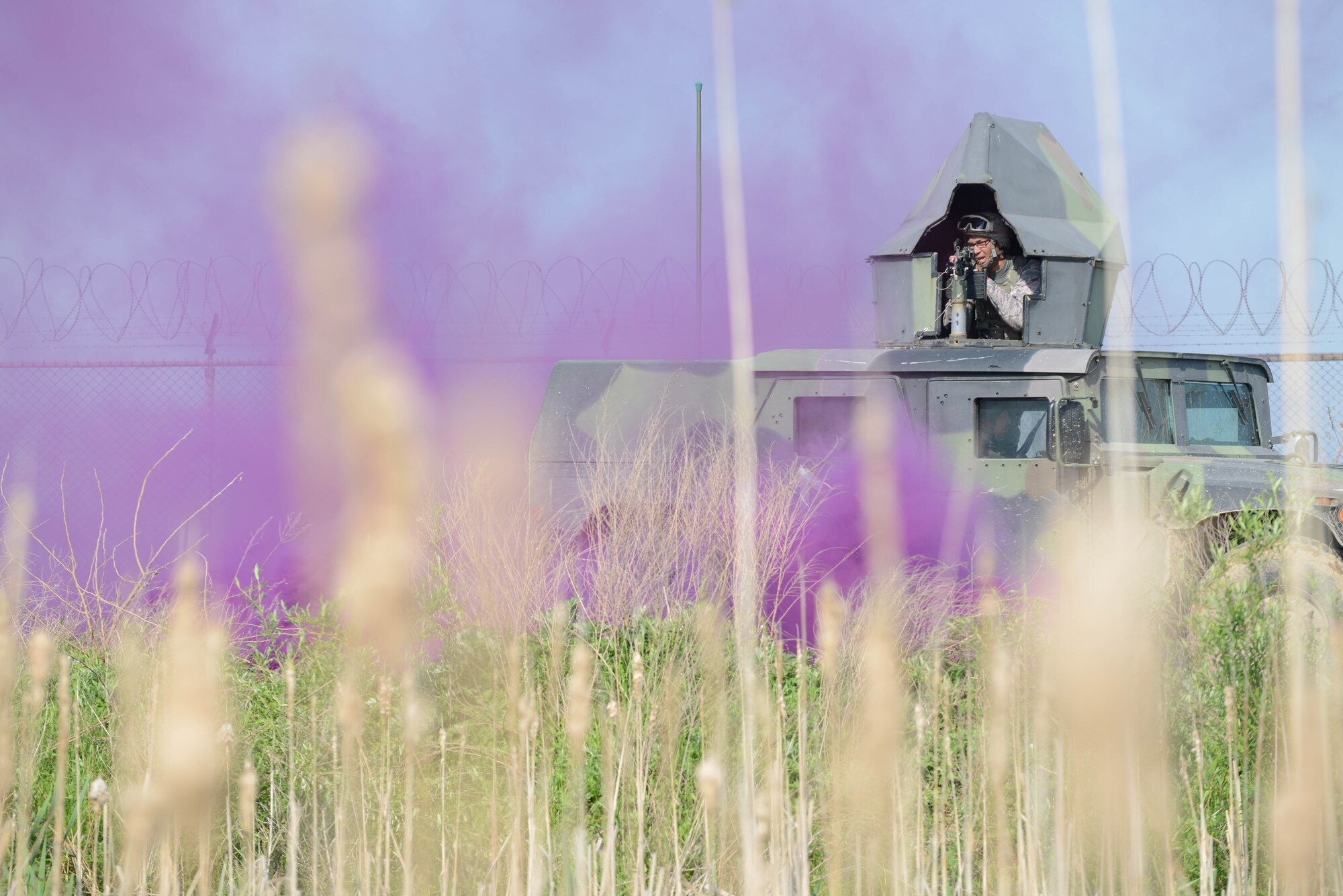 A 51st Security Forces Squadron fire team member searches “outside the wire” for simulated opposing forces during a training scenario for Beverly Herd 16-01 May 10, 2016, at Osan Air Base, Republic of Korea. BH 16-01 is a week-long readiness exercise for the 51st Fighter Wing that includes a plethora of scenarios like chemical, biological, radioactive, and nuclear response, active shooter and opposing forces. (U.S. Air Force photo by Senior Airman Dillian Bamman/Released)