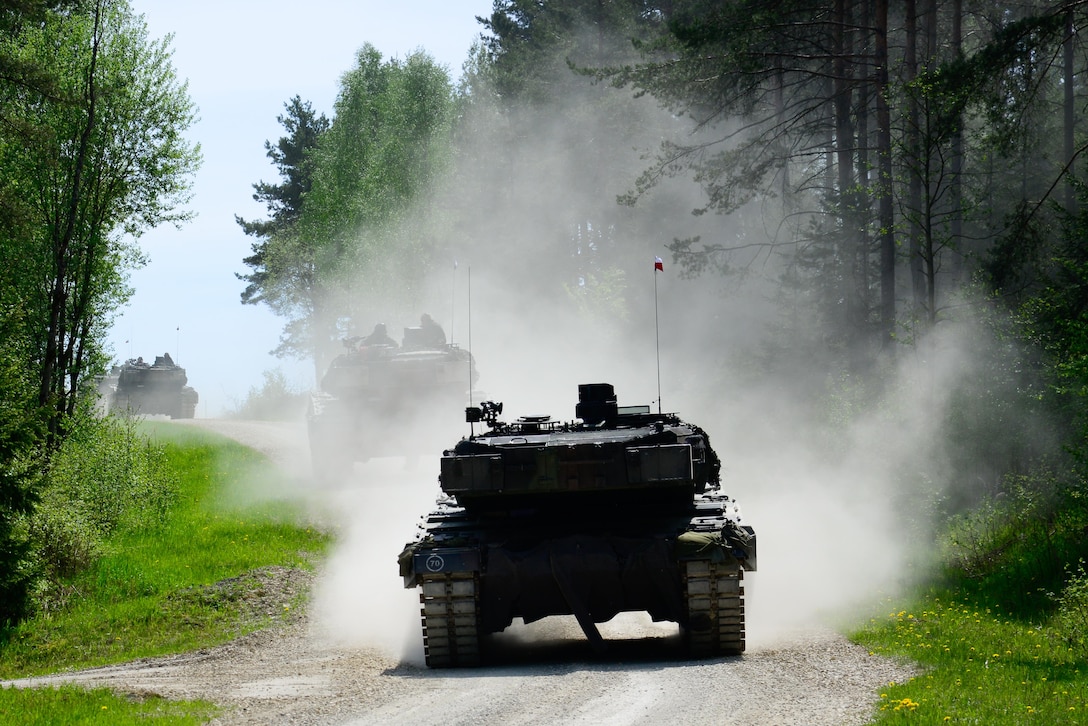 Polish soldiers drive Leopard tanks during the Strong Europe Tank Challenge in Grafenwoehr, Germany, May 10, 2016. Army photo by Pfc. Emily Houdershieldt