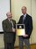 Dr. Andrew Rosenberger, right, an Air Force Research Laboratory engineer, is awarded the American Society for Testing and Materials International Award of Merit by chairman Dr. Ralph Paroli for his distinguished service and exceptional committee work in the area of metals fatigue and fracture. (U.S. Air Force photo/Steve Thompson)