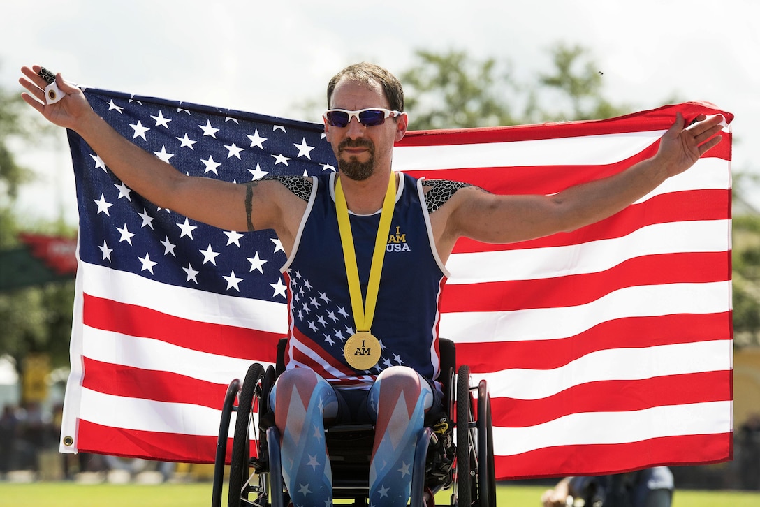 Navy veteran Steven Simmons celebrates after winning the gold medal in a men's 1,500-meter race during the 2016 Invictus Games in Orlando, Fla., May 10, 2016. DoD photo by Roger Wollenberg