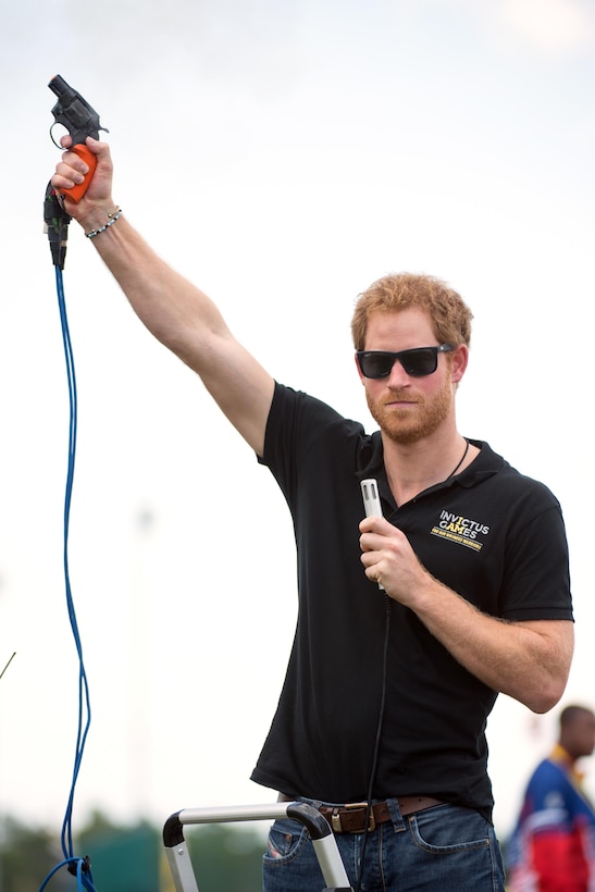 Britain's Prince Harry uses a starting gun for a running event during the 2016 Invictus Games in Orlando, Fla., May 10, 2016. DoD photo by EJ Hersom