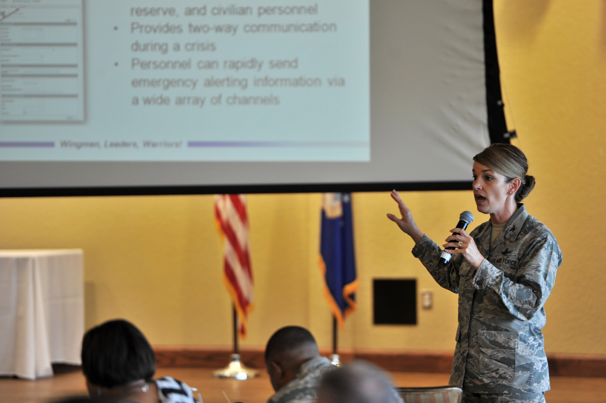 Col. Michele Edmondson, 81st Training Wing commander, discusses the importance of the AtHoc Emergency Notification System at a town hall forum in the Bay Breeze Event Center ballroom, May 3, 2016, Keesler Air Force Base, Miss. Edmondson hosted the forum to discuss current base events, the upcoming hurricane season and fielded a Q-and-A session with attendees. (U.S. Air Force photo by Senior Airman Duncan McElroy)