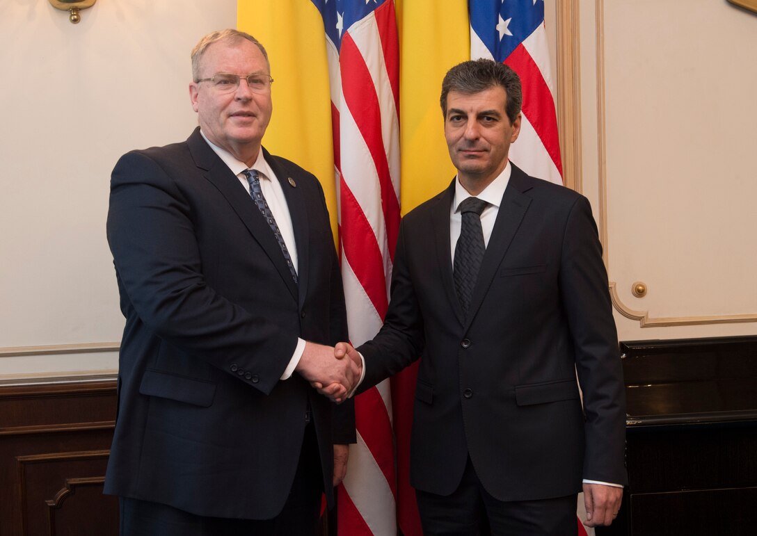 Deputy Defense Secretary Bob Work poses for a photograph with Romanian Defense Minister Mihnea Motoc in Bucharest, Romania, May 11, 2016. DoD photo by Navy Petty Officer 1st Class Tim D. Godbee