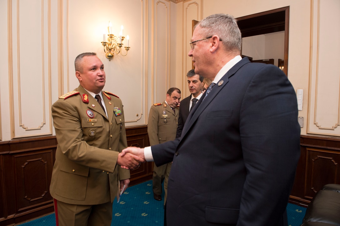 Deputy Defense Secretary Bob Work exchanges greetings with Romanian Army Gen. Nicolae Ciuca, chief of general staff, in Bucharest, Romania, May 11, 2016. DoD photo by Navy Petty Officer 1st Class Tim D. Godbee