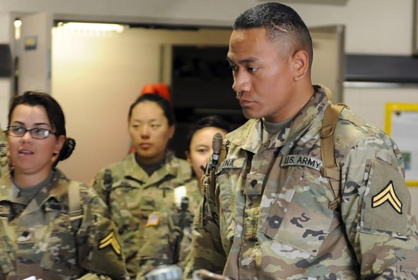 Army Spc. Ina Liaina listens to instructions before assuming the role of incident commander for a simulated mass casualty decontamination drill as part of chemical, biological, radiological and nuclear advanced individual training at Fort Leonard Wood, Mo. Army photo by Stephen Standifird