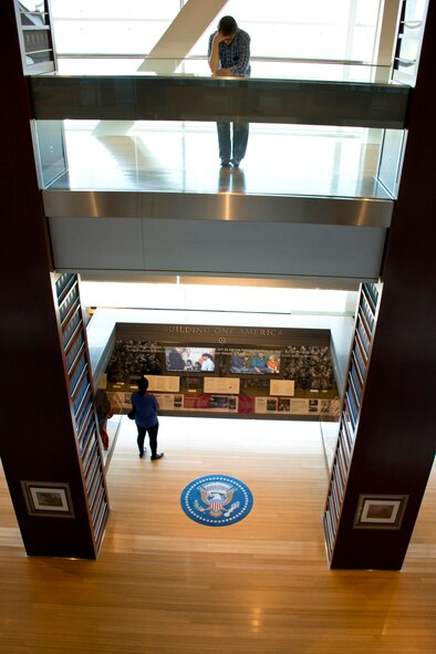 Visitors read the Alcove Exhibits of the second floor and “The Early Years” exhibits of the third floor of the William J. Clinton Presidential Library and Museum in Little Rock, Ark., April 3, 2016. Designed by Ralph Appelbaum and Associates New York, the library contains 20,000 square feet of library and museum space, which include replicas of the Oval Office and the Cabinet Room. (U.S. Air Force photo by Master Sgt. Jeff Walston)   

