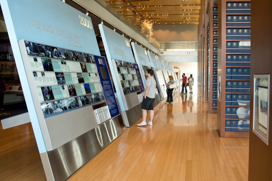 Visitors read the Timeline Exhibit at the William J. Clinton Presidential Library and Museum in Little Rock, Ark., April 3, 2016. The library contains 20,000 square feet of library and museum space, including replicas of the Oval Office and Cabinet Room. (U.S. Air Force photo by Master Sgt. Jeff Walston)   

