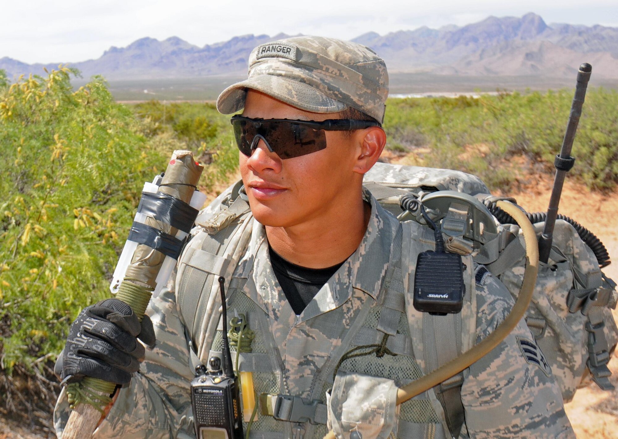 Senior Airman Trevor Manaois, one of the pre-Ranger instructors for the Air Force Security Forces Center observes a candidate-led patrol April 27, 2016, at the Dona Ana Range, New Mexico. (U.S. Army photo/Staff Sgt. Corey Baltos)