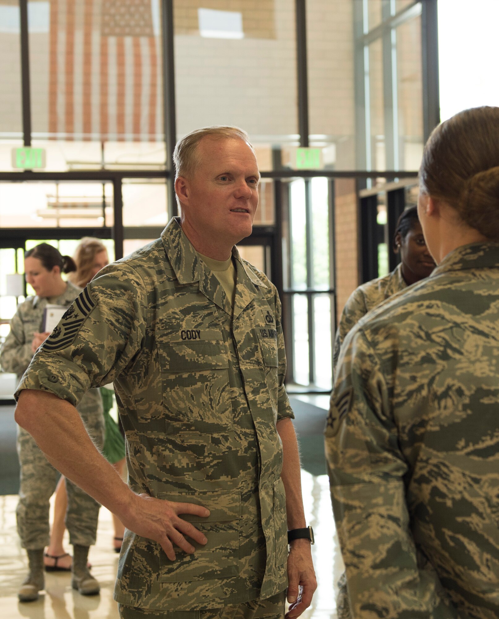 An airman from the 366th Medical Group briefs Chief Master Sgt. of the Air Force James Cody about the hospital, May 5, 2016, at Mountain Home Air Force Base, Idaho. The 366th MDG provides medical services to support approximately 24,000 eligible military beneficiaries. (U.S. Air Force photo by Airman Alaysia Berry/Released)