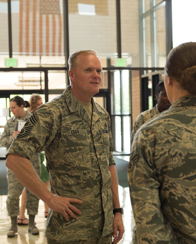 An airman from the 366th Medical Group briefs Chief Master Sgt. of the Air Force James Cody about the hospital, May 5, 2016, at Mountain Home Air Force Base, Idaho. The 366th MDG provides medical services to support approximately 24,000 eligible military beneficiaries. (U.S. Air Force photo by Airman Alaysia Berry/Released)