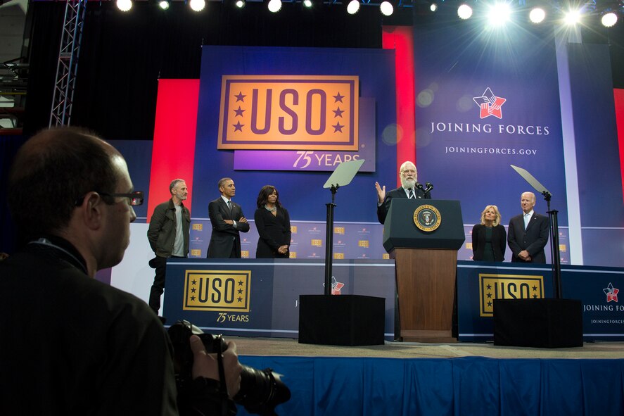 Comedian, writer, producer, actor and former television host David Letterman gives remarks during a USO celebration of its 75th birthday, Military Appreciation Month and the 5th Anniversary of Joining Forces in a hangar on Joint Base Andrews May 5. The special event, called a “Celebration of Service,” featured special guest speakers President and First Lady Obama, Vice President and Second Lady Biden and comedic performances by Jon Steward, David Letterman, Judd Apatow, Mike Birbiglia, Kristen Schaal, Hasan Minhaj, John Mulaney and Jeff Ross. (U.S. Air Force photo/Staff Sgt. Kat Justen)