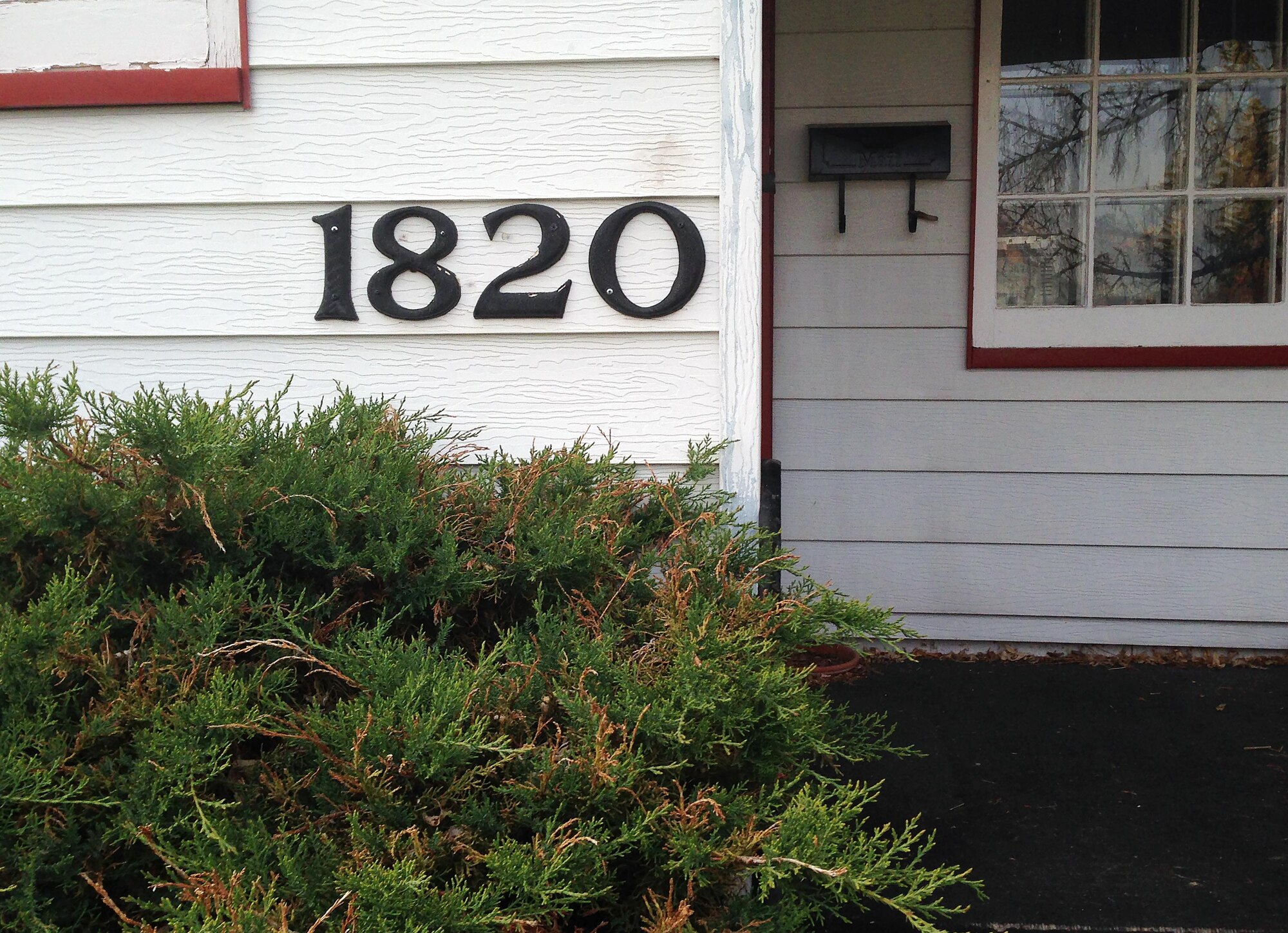 Keeping bushes trimmed and taking other steps to make sure your house address numbers can be clearly seen from the street can make all the difference when first responders are responding to an emergency. Spring is a good time to take a look around to make sure things are safe for your family. (U.S. Air Force photo by R.J. Oriez)