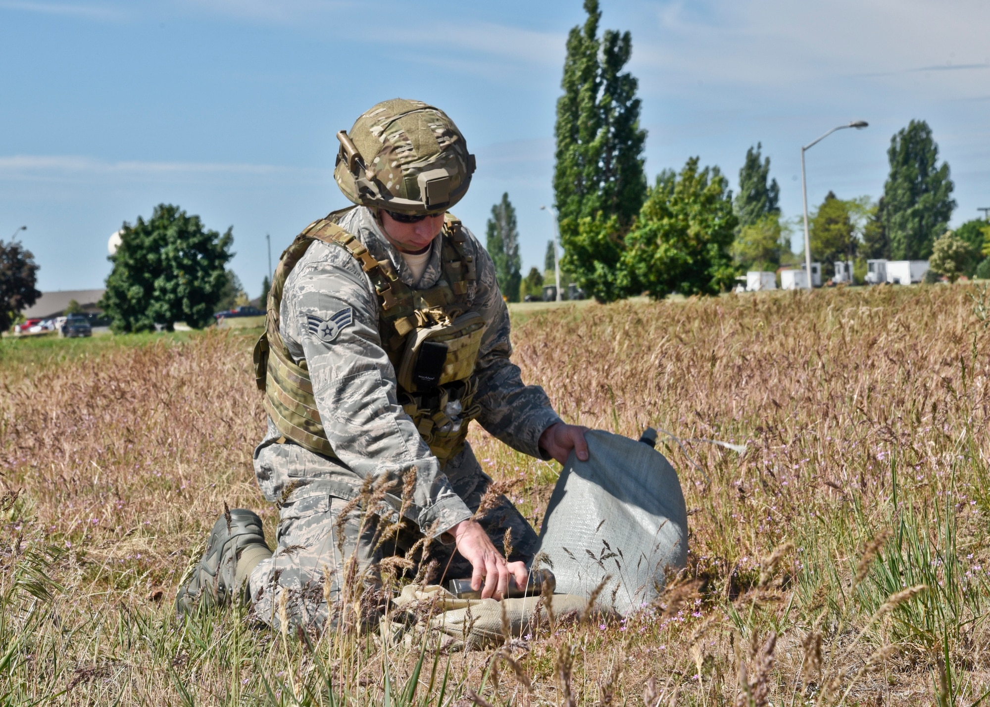 Senior Airman Daniel Simmons, 92nd Civil Engineer Squadron explosive ordinance disposal technician, sets up to disarm a mock MK82 during a training exercise May 11, 2016, at Fairchild Air Force Base, Wash. The training involved various 92nd CES agencies including members from the Fire Department, Emergency Management, Environmental and Explosive Ordinance Disposal; working together to resolve the incident. The crews responded to a simulated aircraft crash where an F-18 experienced various mechanical issues and clipped a nearby structure. During the descent, the pilot was forced to drop armament and then eject. (U.S. Air Force photo/Airman 1st Class Taylor Bourgeous) 