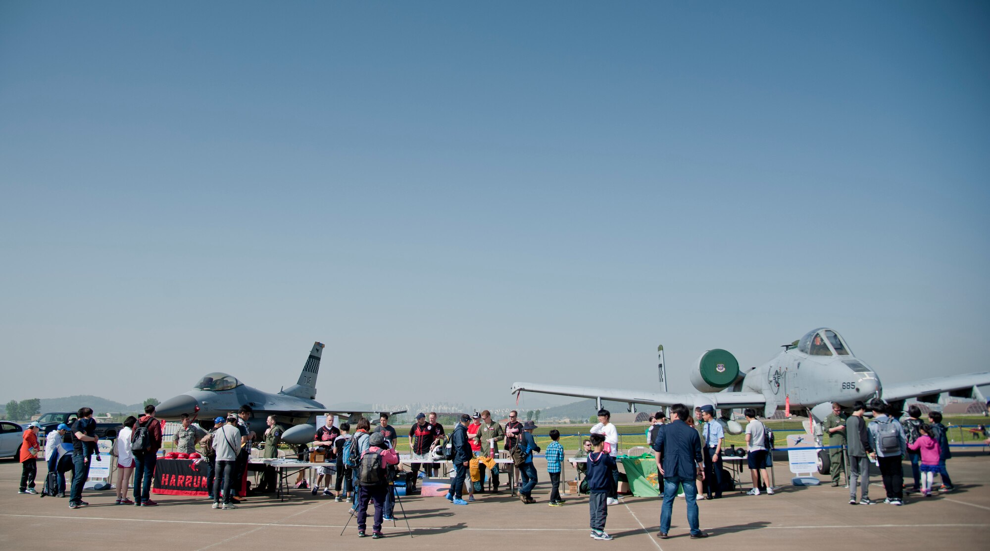 Attendees check out F-16 Fighting Falcon and A-10 Thunderbolt II static displays from Osan Air Base during the Gyeonggi Suwon Airshow 2016 at Suwon Air Base, Republic of Korea, May 7, 2016. Maintainers and pilots from the 51st Aircraft Maintenance Squadrons, 36th Fighter Squadron, 25th Fighter Squadron and 5th Reconnaissance Squadron took photos and answered questions during the airshow. (U.S. Air Force photo by Staff Sgt. Jonathan Steffen/Released)