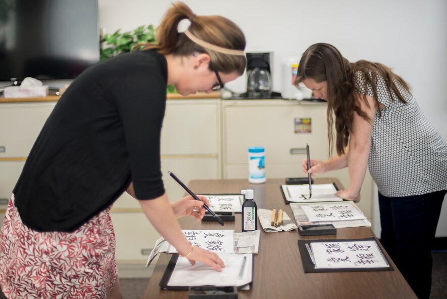 Attendees to the Military Spouse Appreciation Day hosted by the Airman and Family Readiness Center took part in traditional Japanese cultural activities at Yokota Air Base, Japan, May 6, 2016. Activities included a calligraphy class, tea ceremony and a musical performance. (U.S. Air Force photo by Senior Airman David C. Danford/Released)