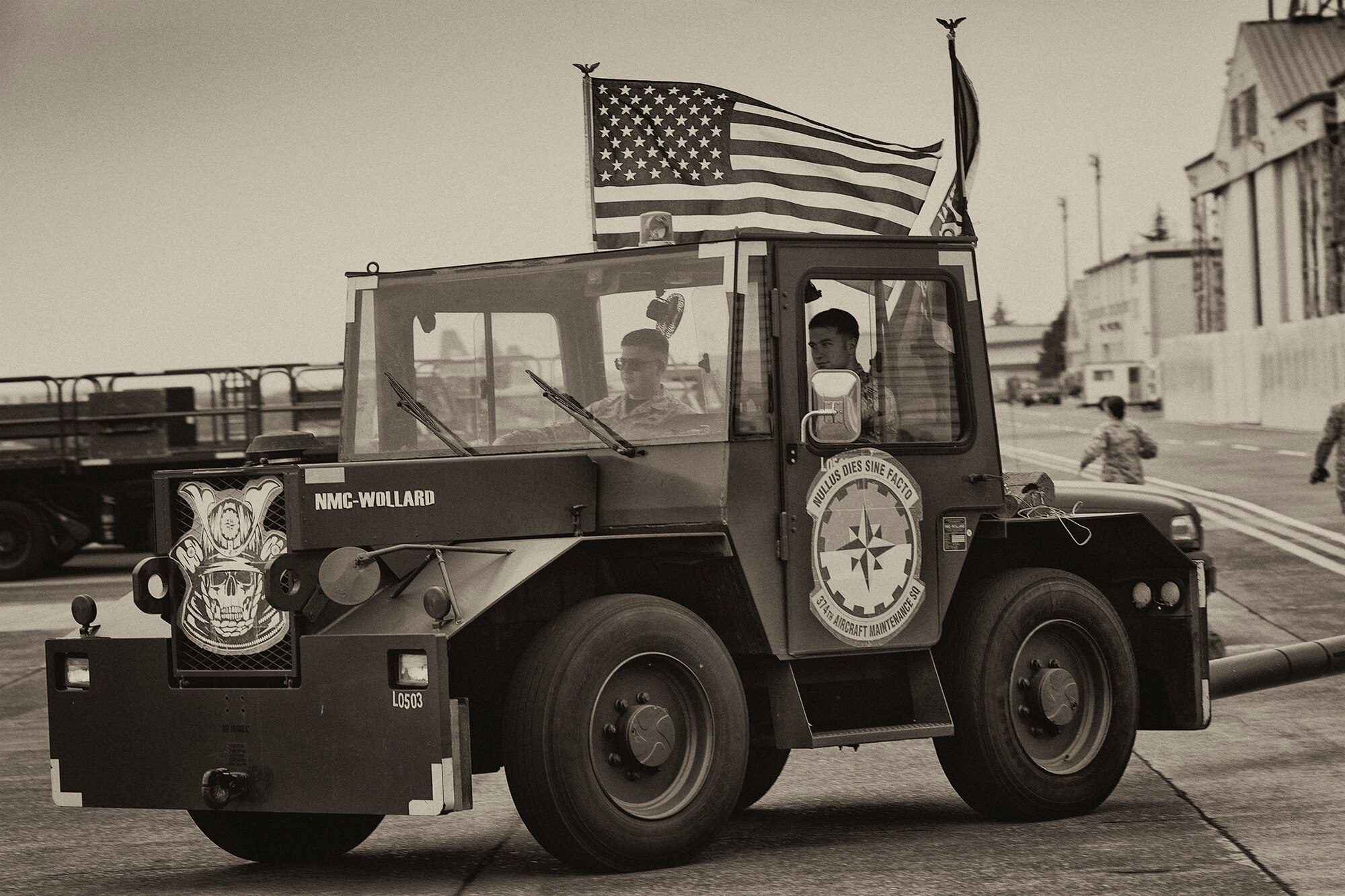 An MB-4 aircraft tow vehicle assigned to the 374th Aircraft Maintenance Squadron parades on the flightline during the 730th Air Mobility Squadron Rodeo at Yokota Air Base, Japan, May 6, 2016. The 730 AMS hosted the rodeo to open communications between their unit and the 374th Maintenance Group. (U.S. Air Force photo by Yasuo Osakabe/Released) 