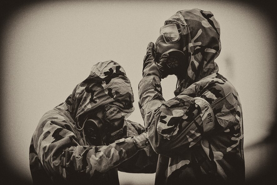 Airmen with the 730th Air Mobility Squadron wear Mission Oriented Protective Postures (MOPP) gear in the MOPP and Self Aid Buddy Care timed event, during the 730 AMS Maintenance Rodeo at Yokota Air Base, Japan, May 6, 2016. Six teams participated in the rodeo which had a variety of challenges: tool box inventory, safety wire skill, vehicle tow bar push, power cart relay race and Mission Oriented Protective Postures (MOPP) gear and Self Aid Buddy Care (SABC) timed event. (U.S. Air Force photo by Yasuo Osakabe/Released)