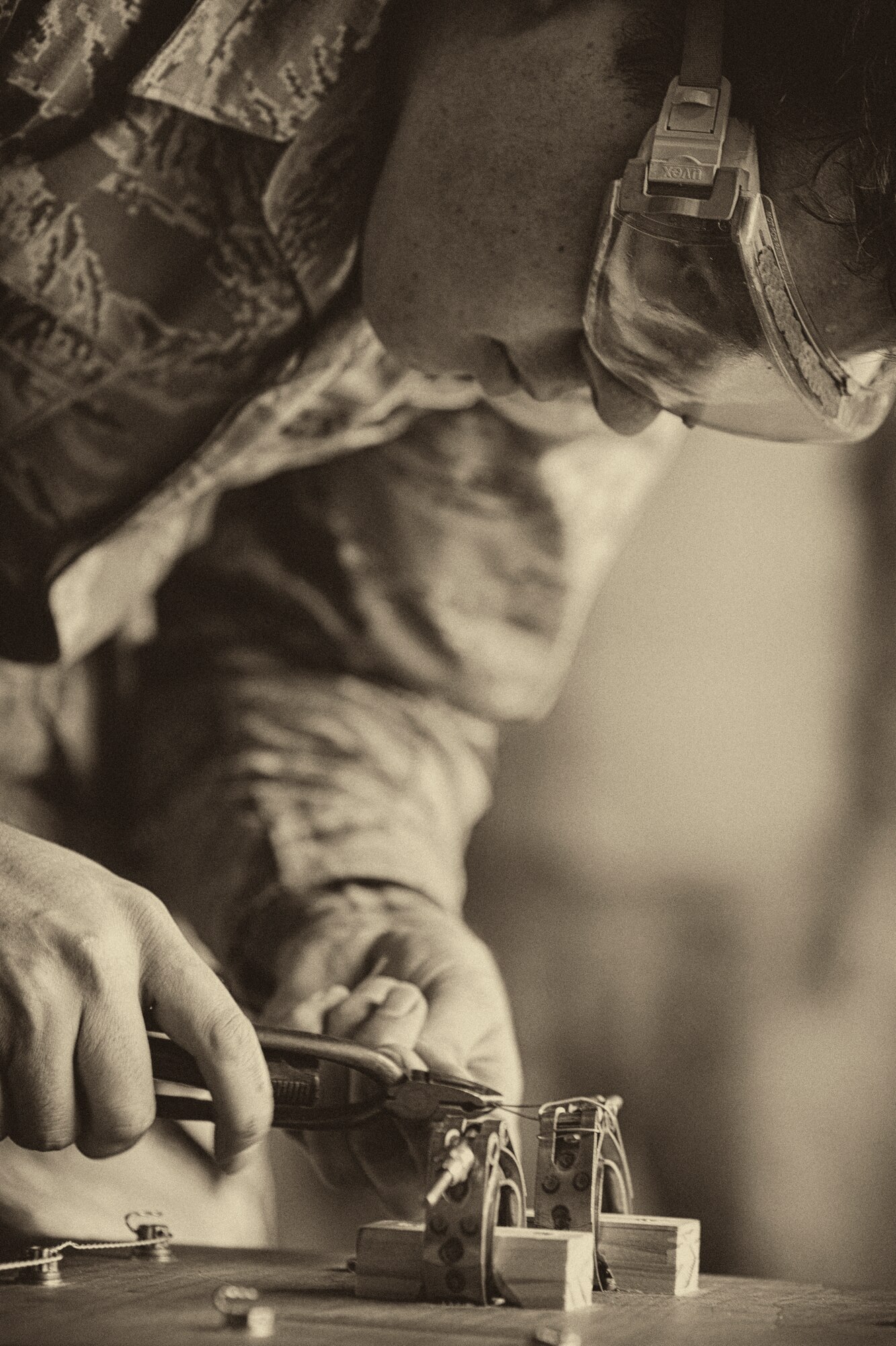 Staff Sgt. Michael Kowalski, 730th Air Mobility Squadron, participates in a safety wire skill timed event, during the 730 AMS Maintenance Rodeo at Yokota Air Base, Japan, May 6, 2016. Six teams participated in the rodeo which had a variety of challenges: tool box inventory, safety wire skill, vehicle tow bar push, power cart relay race and Mission Oriented Protective Postures (MOPP) gear and Self Aid Buddy Care (SABC) timed event. (U.S. Air Force photo by Yasuo Osakabe/Released)  
