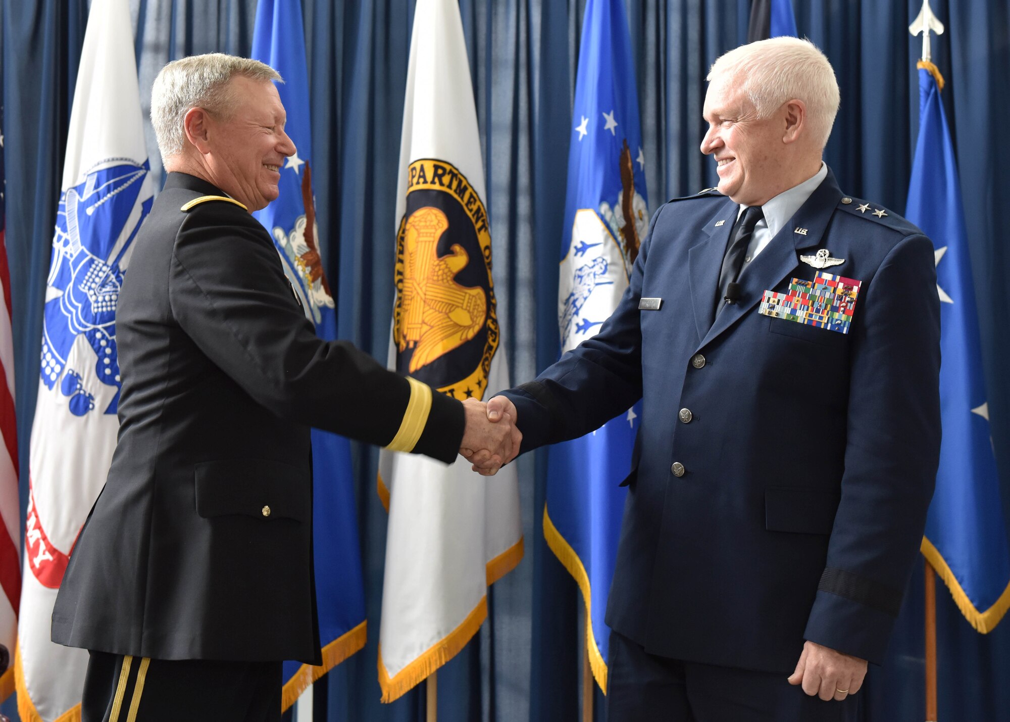 Army Gen. Frank Grass, chief of the National Guard Bureau, shakes hands with Air National Guard Director Lt. Gen. Scott Rice during a promotion and assumption of responsibility ceremony in Rice's honor at the Air National Guard Readiness Center on Joint Base Andrews May 10, 2016. Rice, who previously served as the adjutant general of the Massachusetts National Guard, became the 14th director of the ANG. (U.S. Army National Guard photo by Staff Sgt. Michelle Gonzalez/Released)