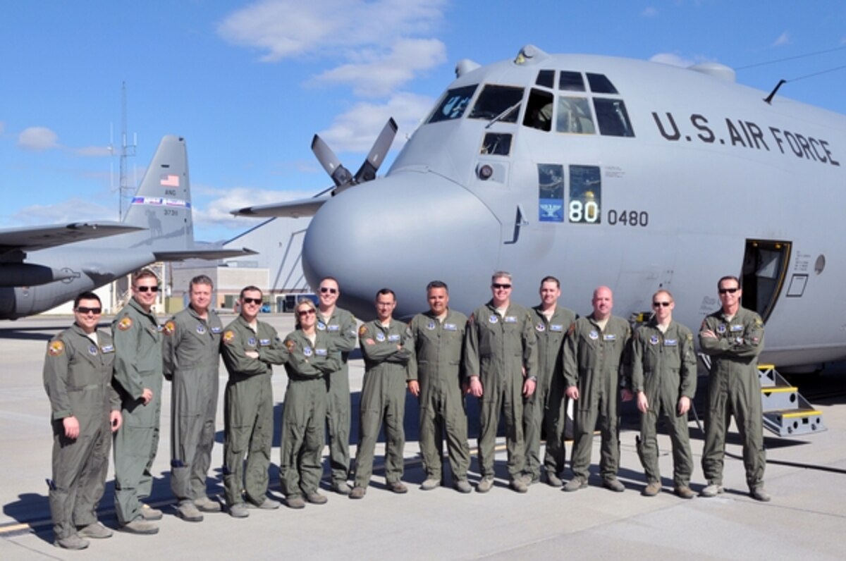 Members of the 152nd Airlift Wing, Nevada Air National Guard, pose for a photo on the flight line at the Nevada Air National Guard Base in Reno before their flight to Channel Islands Air National Guard Station, Calif., this week for the unit’s first Modular Airborne Fire Fighting System certification and training. Maj. Ricardo Bravo, seventh from the left, saw firsthand last summer how MAFFS can stop a fire line when aircrews dropped retardant near his northern California farm. Photo by Tech. Sgt. Emerson Marcus