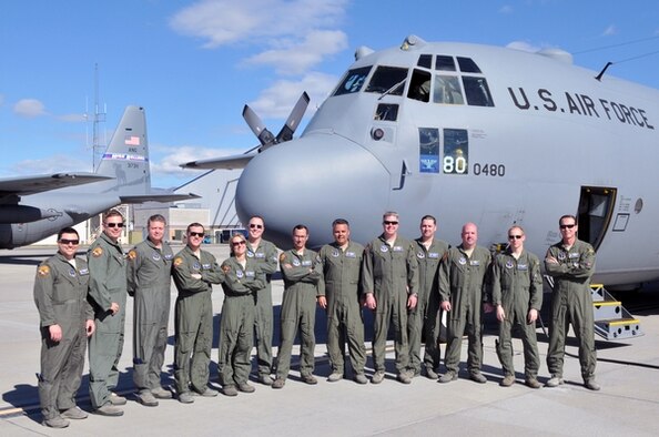 Members of the 152nd Airlift Wing, Nevada Air National Guard, pose for a photo on the flight line at the Nevada Air National Guard Base in Reno before their flight to Channel Islands Air National Guard Station, Calif., this week for the unit’s first Modular Airborne Fire Fighting System certification and training. Maj. Ricardo Bravo, seventh from the left, saw firsthand last summer how MAFFS can stop a fire line when aircrews dropped retardant near his northern California farm. Photo by Tech. Sgt. Emerson Marcus