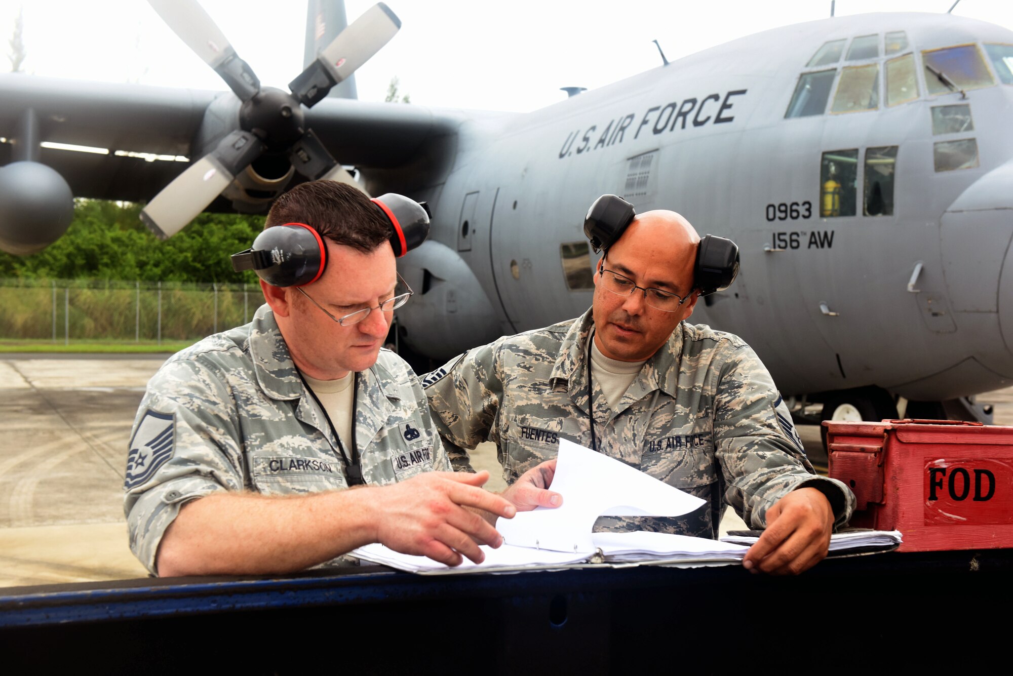 U.S. Air Force Master Sgt. Jeremy Clarkson, Air Mobility Command aircraft maintenance inspector, reviews a hurricane evacuation plan checklist with Master Sgt. Julio Fuentes, 156th Maintenance Squadron aircraft maintenance coordinator, during a category 5 hurricane exercise on Muñiz Air National Guard Base, Carolina, Puerto Rico, April 30. Members of the AMC Inspector General team completed a mid-point review visit to evaluate the 156th Wing Inspection Team. (U.S. Air National Guard photo by Tech. Sgt. Efraín Sánchez)