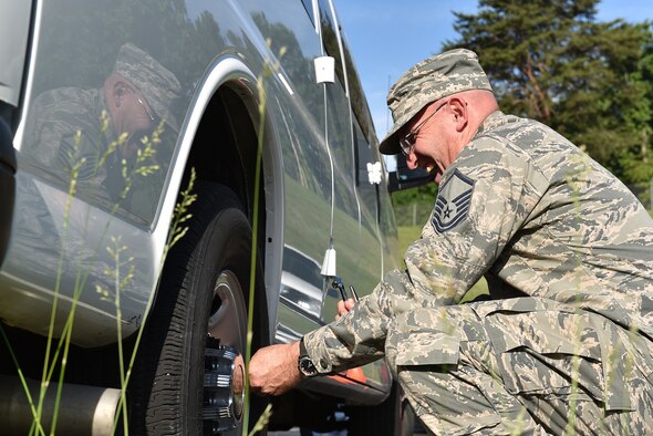 MCGHEE TYSON AIR NATIONAL GUARD BASE, Tenn. - Master Sgt. Don Pierson laughs as he checks the tire pressure on a government van here May 10, 2016, while managing his morning duties at the I.G. Brown Training and Education Center. Pierson is preparing for a reassignment after more than 10 years' service on campus. (U.S. Air National Guard photo by Master Sgt. Mike R. Smith/Released)