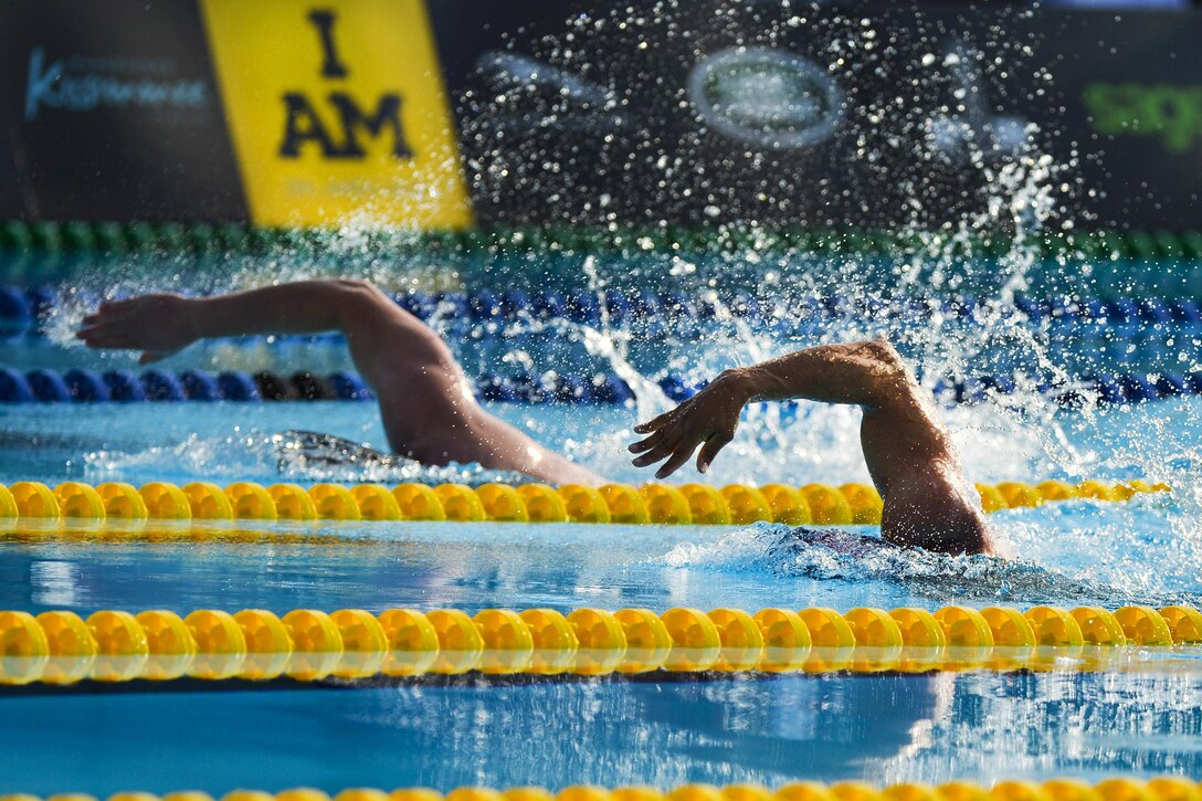 Competitors swim in the 50-meter freestyle event at the 2016 Invictus Games in Orlando, Fla., May 11, 2016. Air Force photo by Tech. Sgt. Joshua L. DeMotts