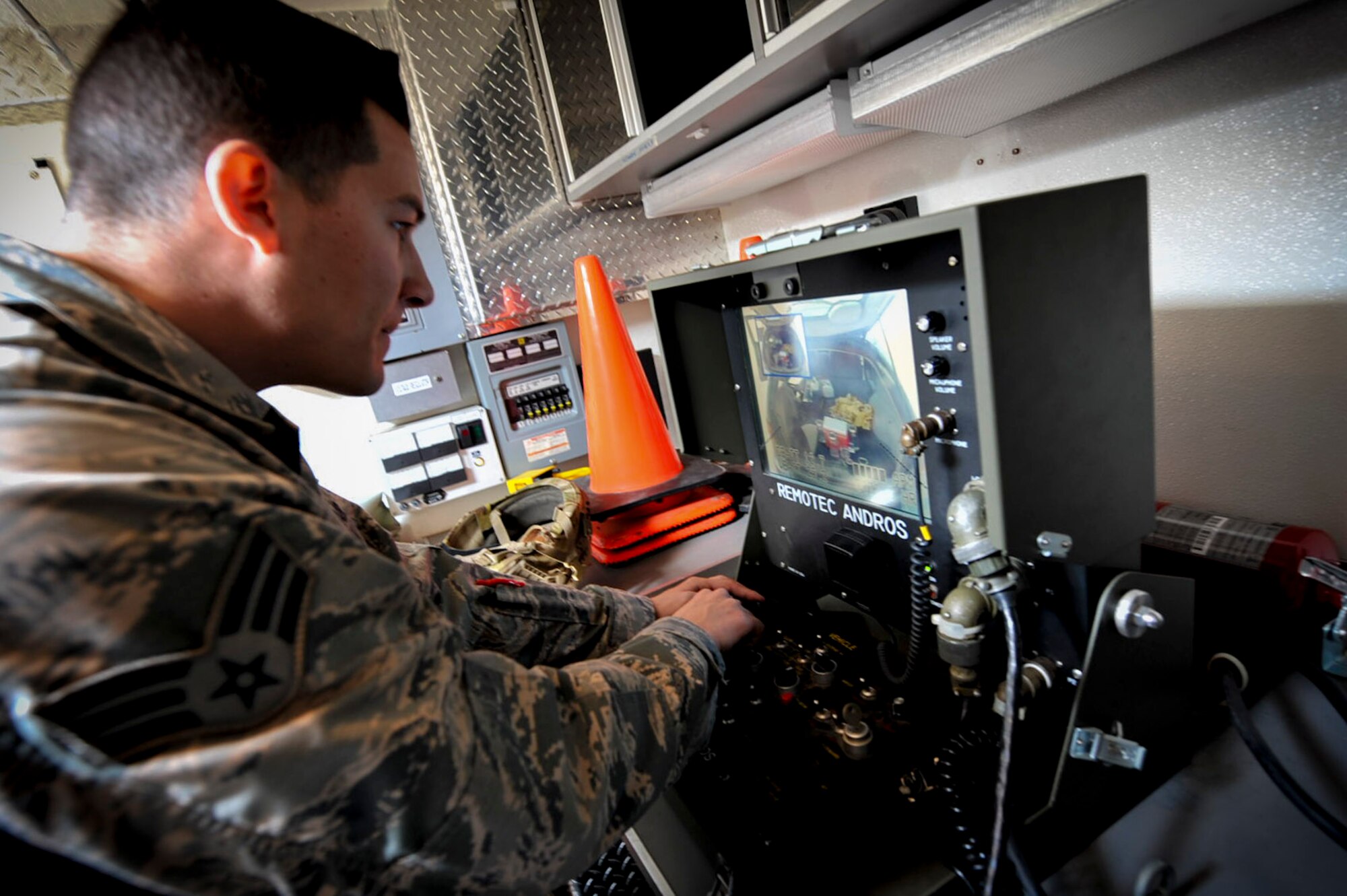 Senior Airman Ken Park, 51st Civil Engineer Squadron explosive ordnance disposal technician, operates an F6A EOD robot during a mock chemical improvised explosive device training exercise at Osan Air Base, Republic of Korea, May 12, 2016. This exercise tested emergency responders on their ability to safely respond to an IED. (U.S. Air Force photo by Staff Sgt. Jonathan Steffen/Released)