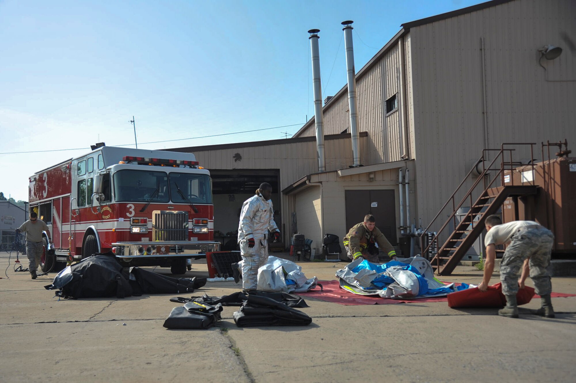 Firefighters from the 51st Civil Engineer Squadron setup a decontamination line during Exercise Beverly Herd 16-01 at Osan Air Base, Republic of Korea, May 12, 2016. The firefighters tested their skills to respond to a mock chemical improvised explosive device. (U.S. Air Force photo by Staff Sgt. Jonathan Steffen/Released)