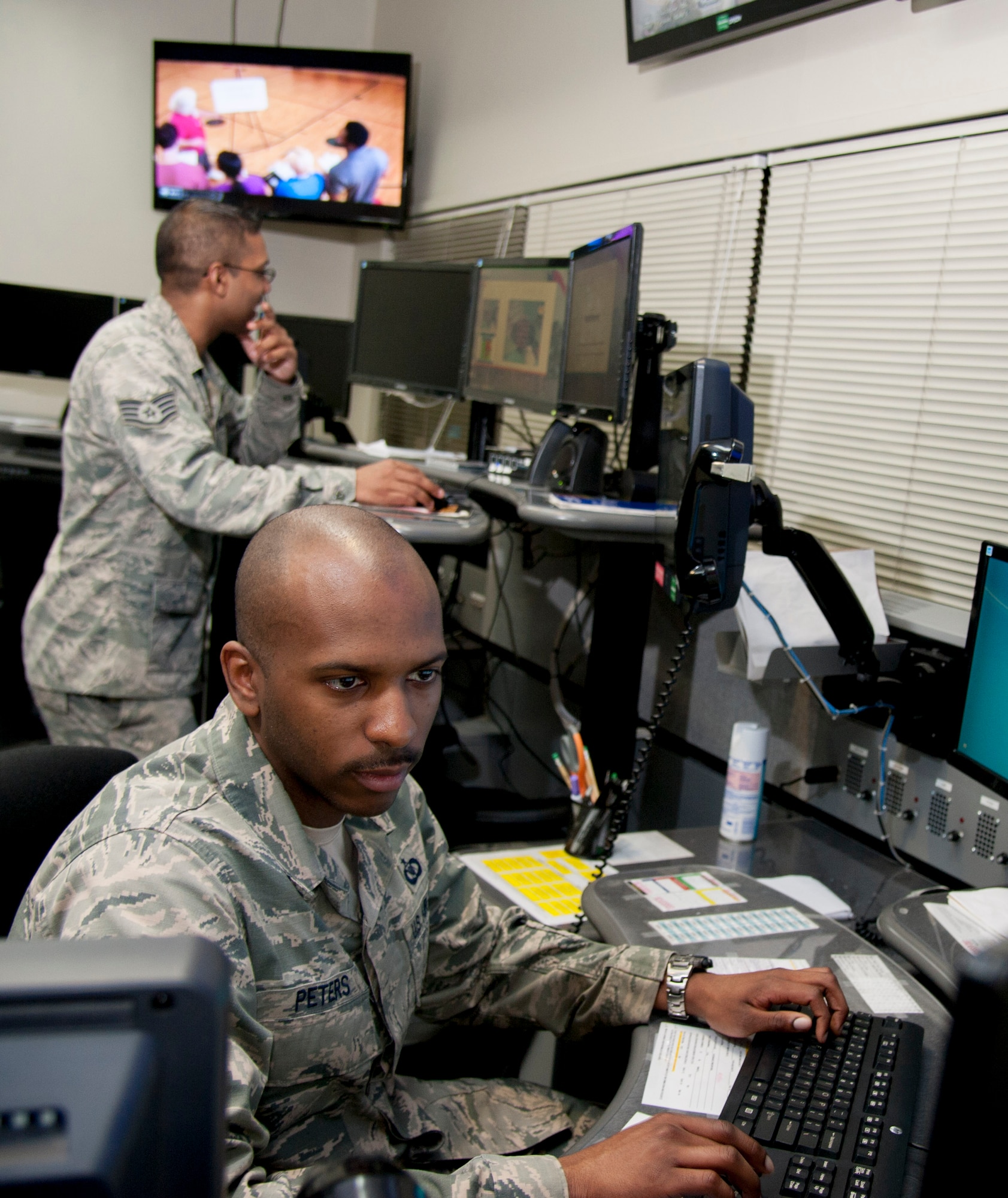 Staff Sgt. Brenton Hobson and Staff Sgt. Gabriel Peters, 51st Fighter Wing senior emergency action controllers, man their crew positions in the command post on Osan Air Base, Republic of Korea, April 26, 2016. The 51st FW command post won the 2015 Medium Command Post of the Year award. (U.S. Air Force photo by Staff Sgt. Jonathan Steffen/Released)