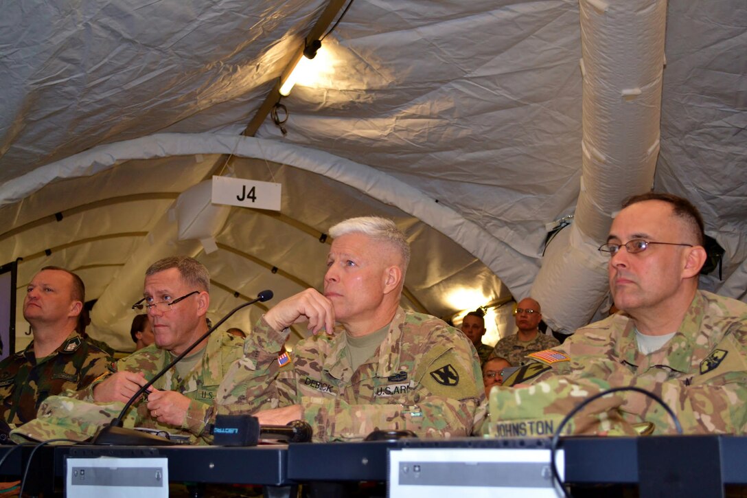 Brig. Gen. Arlan DeBlieck, center, commanding general of the 7th Mission Support Command, listens to a Commander's Update Brief during Exercise Anakonda Response 2016, Friday, April 29, 2016 at Papa Air Base in Hungary. For the roughly two-week long event, the U.S. organized a full assembly of military representation: Army, Navy, Marine Corps, Army Reserve, Army National Guard and Air National Guard. Also, the Hungarian military hosted the United Kingdom’s Royal Army and Corps of Royal Marines. 