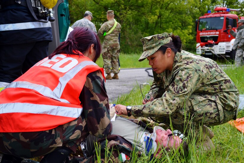 U.S. Navy 1st Class Petty Ofc. Nichole Gacayan worked with Hungarian first responders to assess victims of a simulated vehicle crash during Exercise Anakonda Response 2016, Thursday, May 5, 2016 at Papa Air Base.