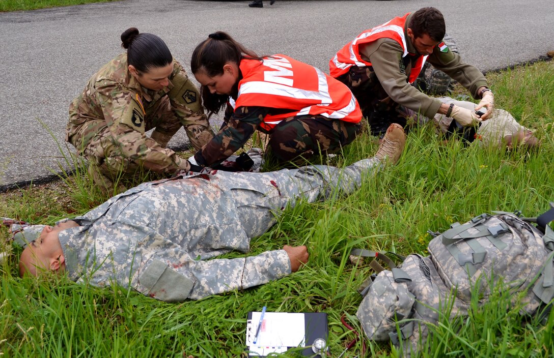 U.S. Army Sgt. Erin Hodge works with Hungarian first responders to assess victims of a simulated vehicle crash during Exercise Anakonda Response 2016, Thursday, May 5, 2016 at Papa Air Base. 