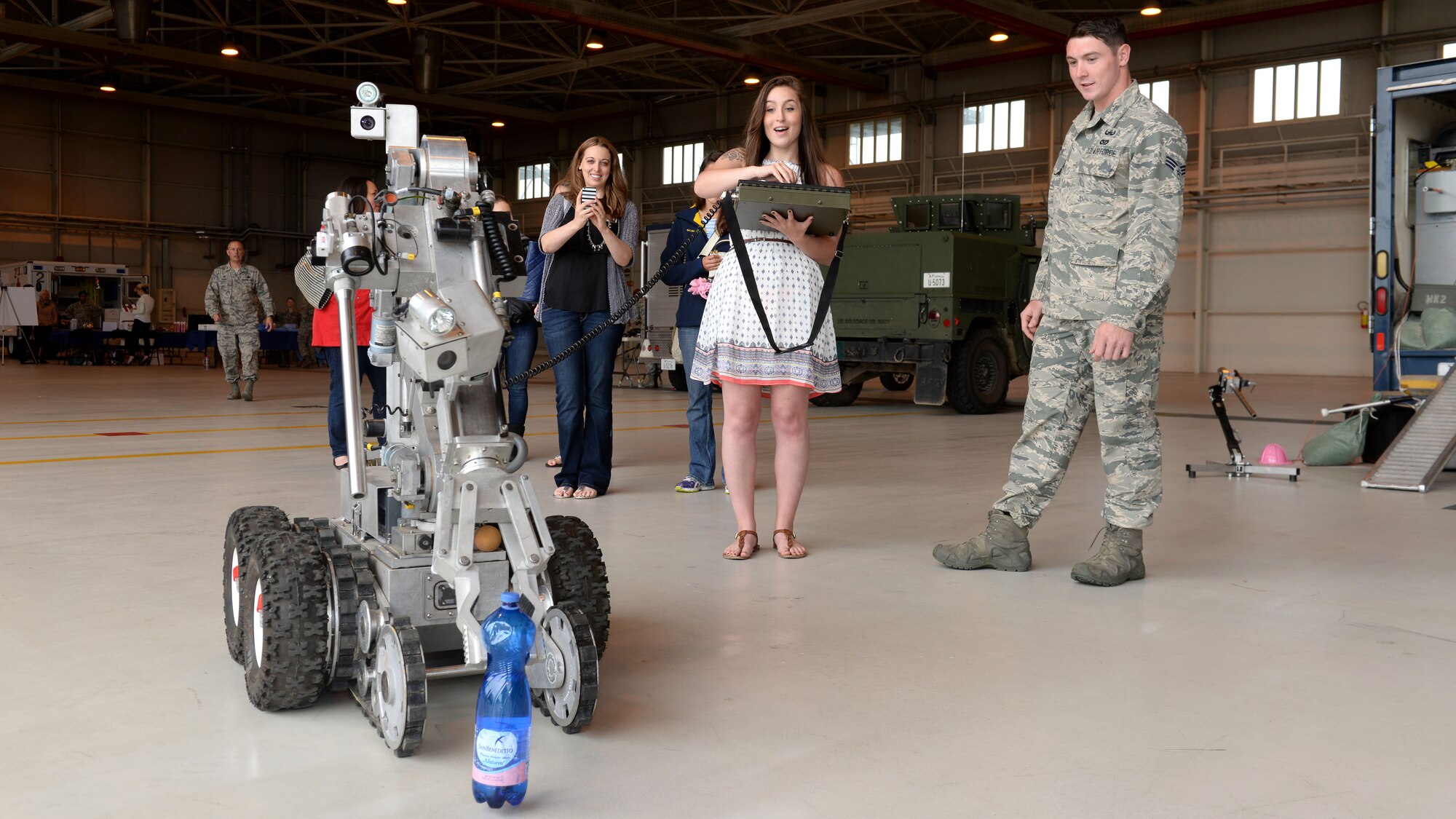 Edin Gutierrez controls an explosive ordnance disposal robot during the first wing-led Spouses Appreciation Day tour, May 10, 2016, at Aviano Air Base, Italy. Spouses participated in hands-on activities to better understand the 31st Fighter Wing’s mission. (U.S. Air Force photo by Airman 1st Class Cary Smith/Released)