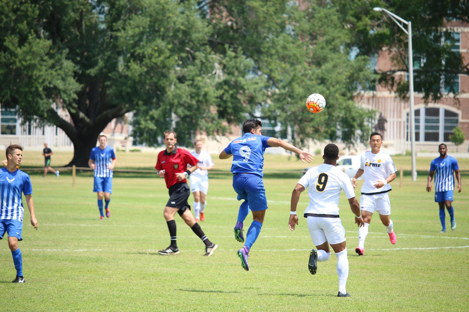 1st Lt. Aaron Zendejas (blue #9) seen here heading the ball, scored the second goal of the match to give Air Force a 2-0 lead at halftime.  Air Force defeated Army 3-0 to win match six of the 2016 Armed Forces Men's Soccer Championship hosted at Fort Benning, Ga from 6-14 May 2016.  Navy advances to the Championship Match versus Air Force.