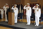 Rear Adm. John P. Neagley (2nd from right) relieved Rear Adm. Brian K. Antonio (3rd from right)  as program executive officer for the Littoral Combat Ship (LCS) program during a change of office ceremony May 10 at the Washington Navy Yard.