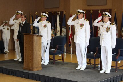 Rear Adm. John P. Neagley (2nd from right) relieved Rear Adm. Brian K. Antonio (3rd from right)  as program executive officer for the Littoral Combat Ship (LCS) program during a change of office ceremony May 10 at the Washington Navy Yard.