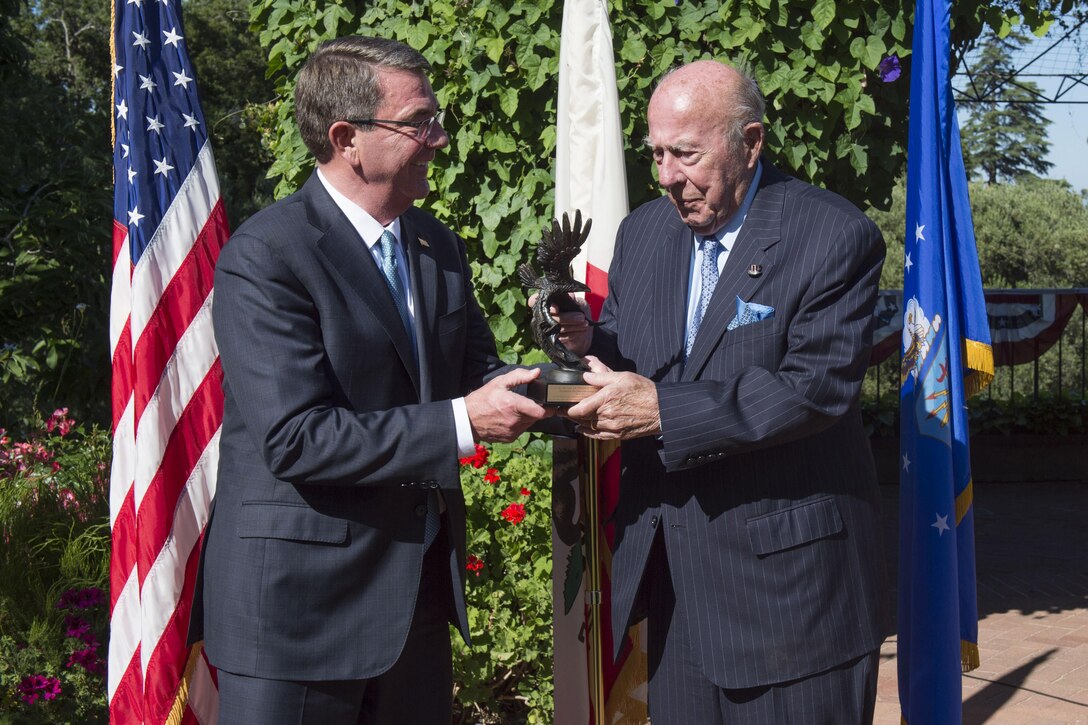 Defense Secretary Ash Carter presents former Secretary of State George P. Shultz with the Innovators in Defense, Enterprise, Academia and Science award during a ceremony at the Lou Henry Hoover House in Stanford, Calif., May 11, 2016. DoD photo by Air Force Senior Master Sgt. Adrian Cadiz