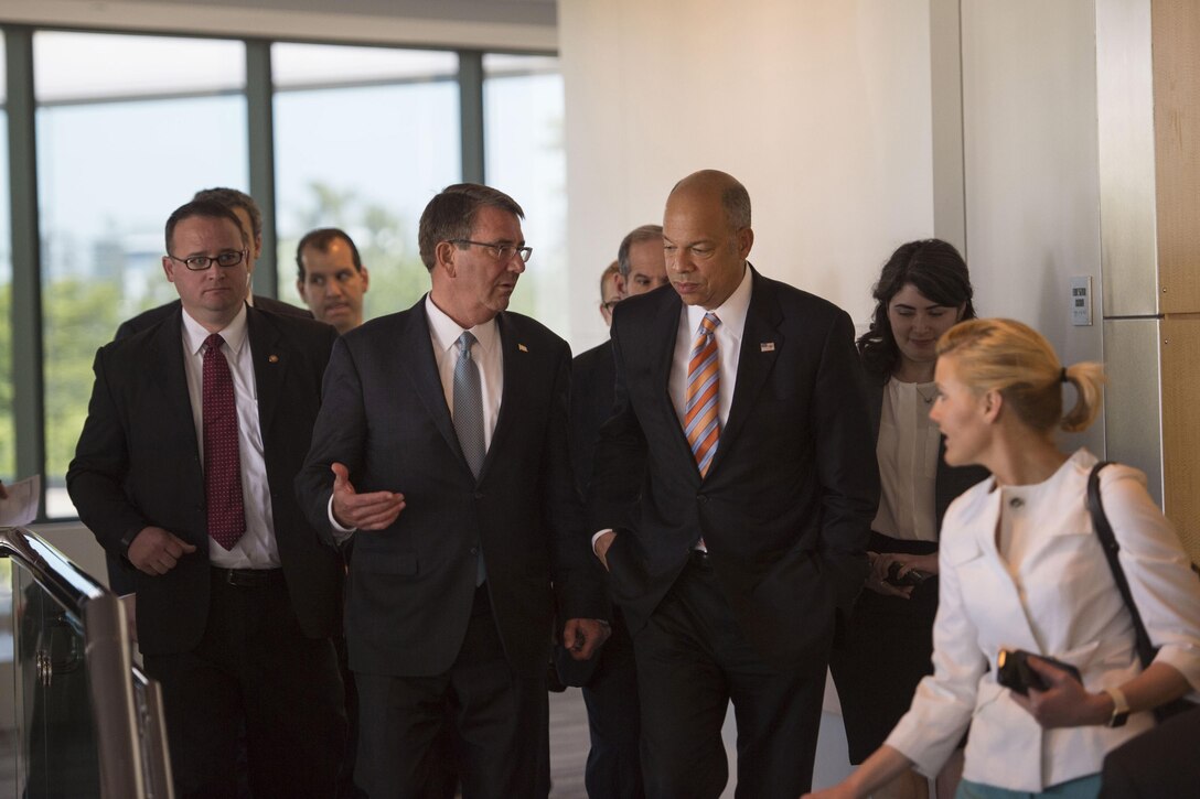 Defense Secretary Ash Carter, left, walks with Homeland Security Secretary Jeh Johnson, right, as they depart Intel Corporation after participating in the National Security Telecommunications Advisory Committee meeting in Santa Clara, Calif., May 11, 2016. DoD photo by Air Force Senior Master Sgt. Adrian Cadiz