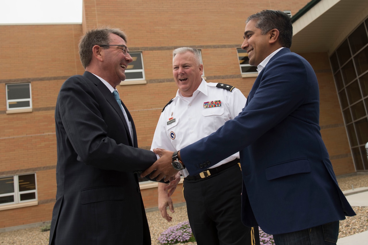 Defense Secretary Ash Carter receives a warm welcome from Raj Shah, the newly appointed managing director of Defense Innovation Unit Experimental, as he arrives in California, May 11, 2016. Carter later spoke with the unit's employees during his trip to California to meet with technology leaders. DoD photo by Air Force Senior Master Sgt. Adrian Cadiz