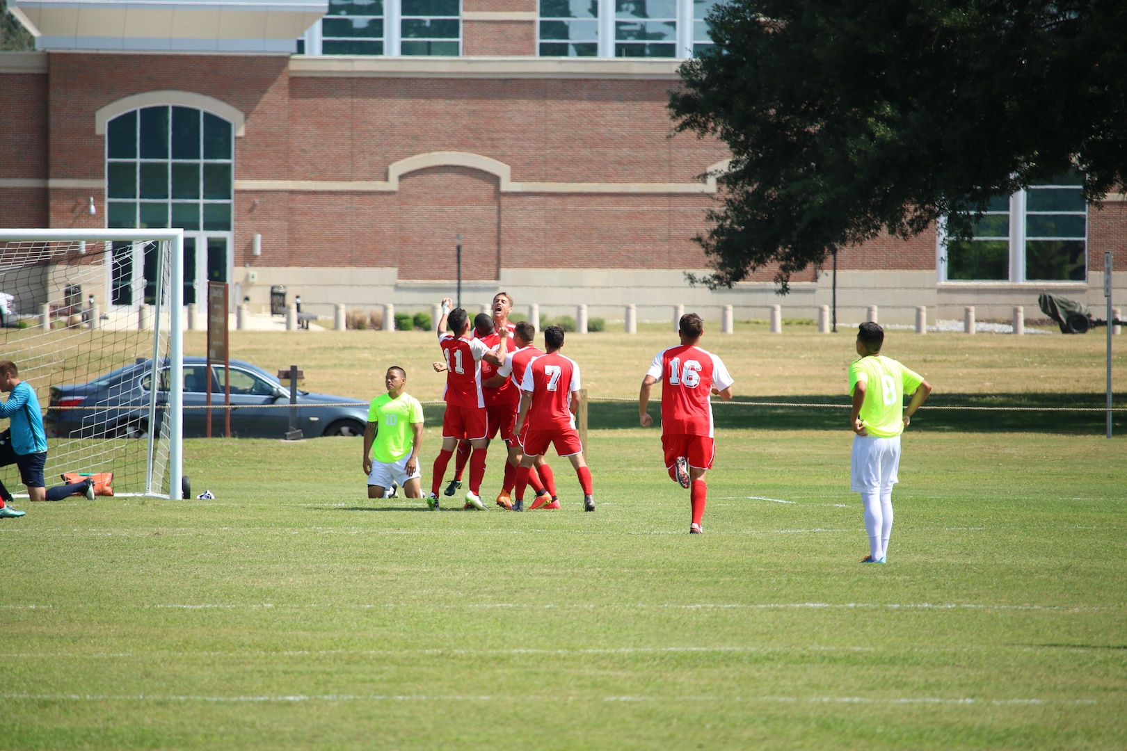 Marines celebrate Cpl Kyle DeSousa's goal at the start of the second half of match five. Navy won the match 2-1 of the 2016 Armed Forces Men's Soccer Championship hosted at Fort Benning, Ga from 6-14 May 2016.  Navy advances to the Championship Match versus Air Force.